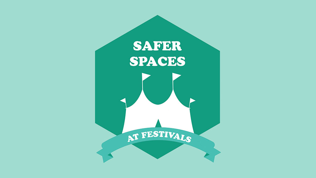 Safer Spaces At Festivals logo with white text on a green hexagon background featuring a white tent illustration