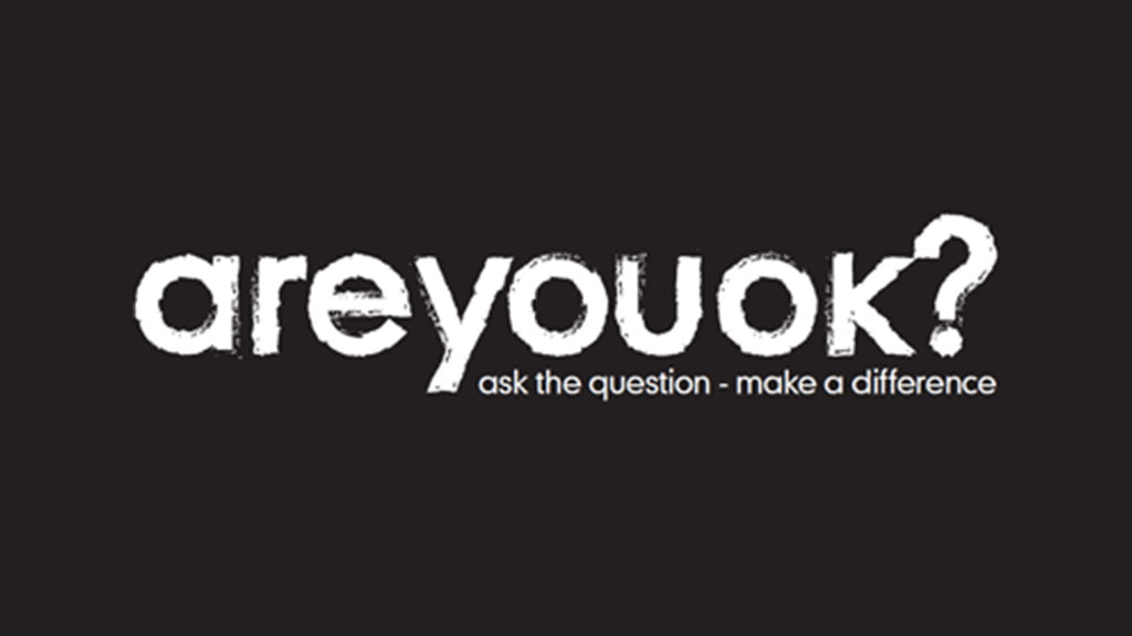 Are You OK? logo with white text on a black background and the tagline 'ask the question - make a difference