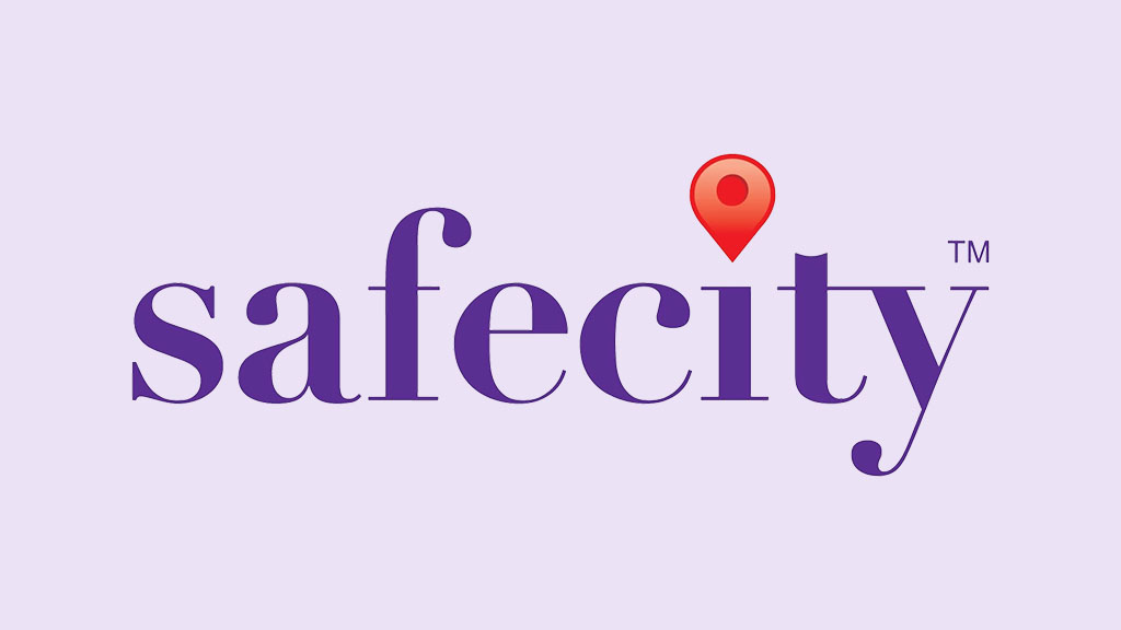 SafeCity logo with purple text and a red map pin above the letter 'i' on a light purple background